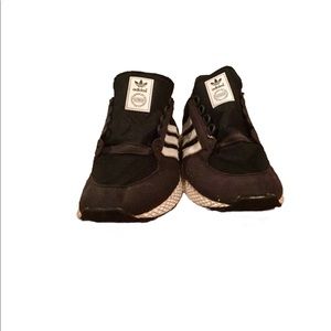 Boy’s athletic adidas black white striped shoes